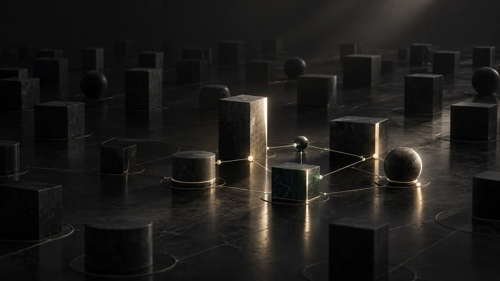 A field of dark stone forms on marble with a small, connected cluster illuminated by a single beam of light.